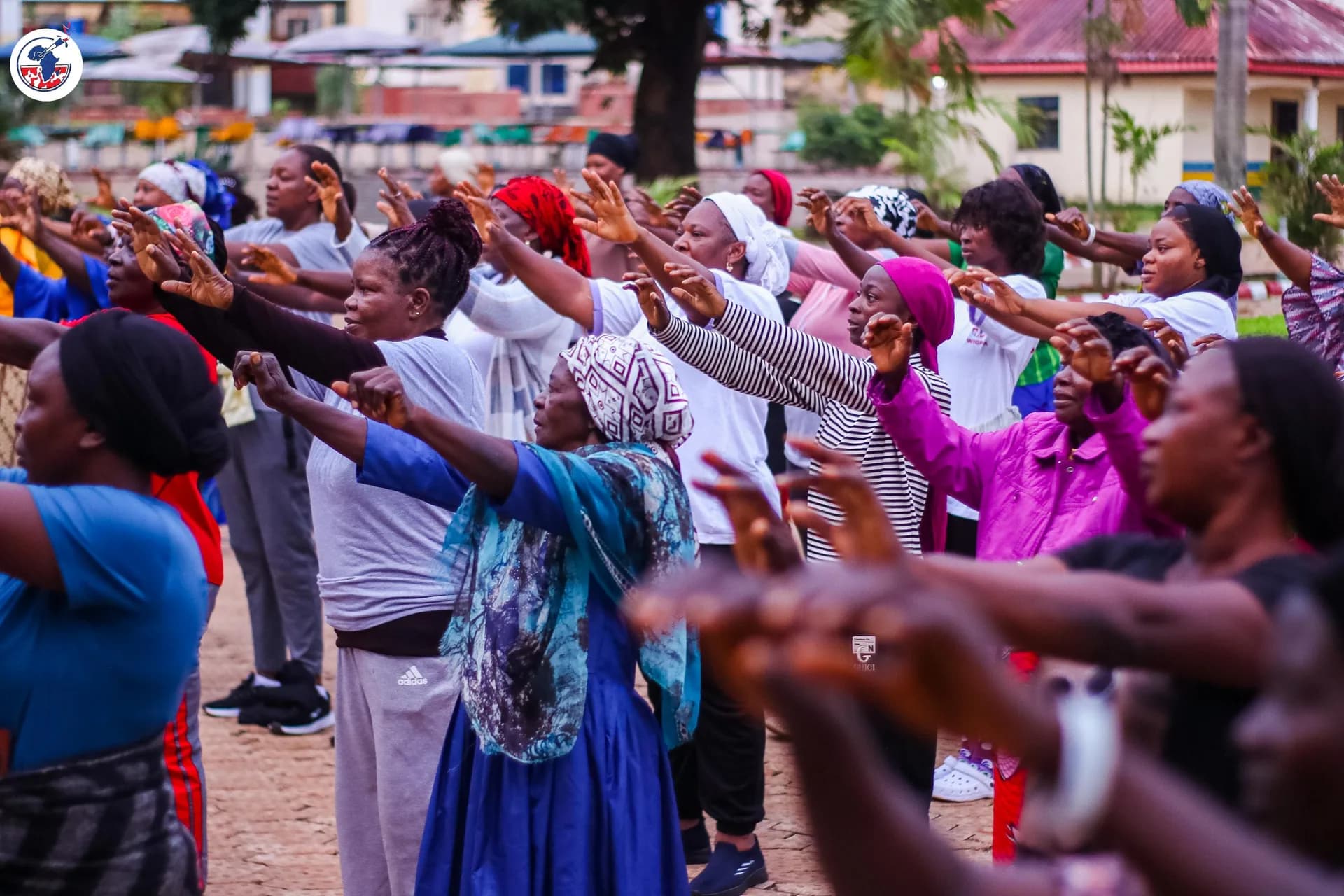 The WIGPA assembly lifting their hands in worship as one.