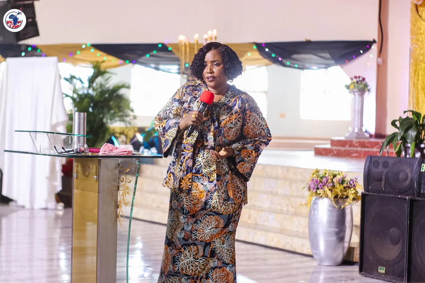 A leader standing to address the gathering.