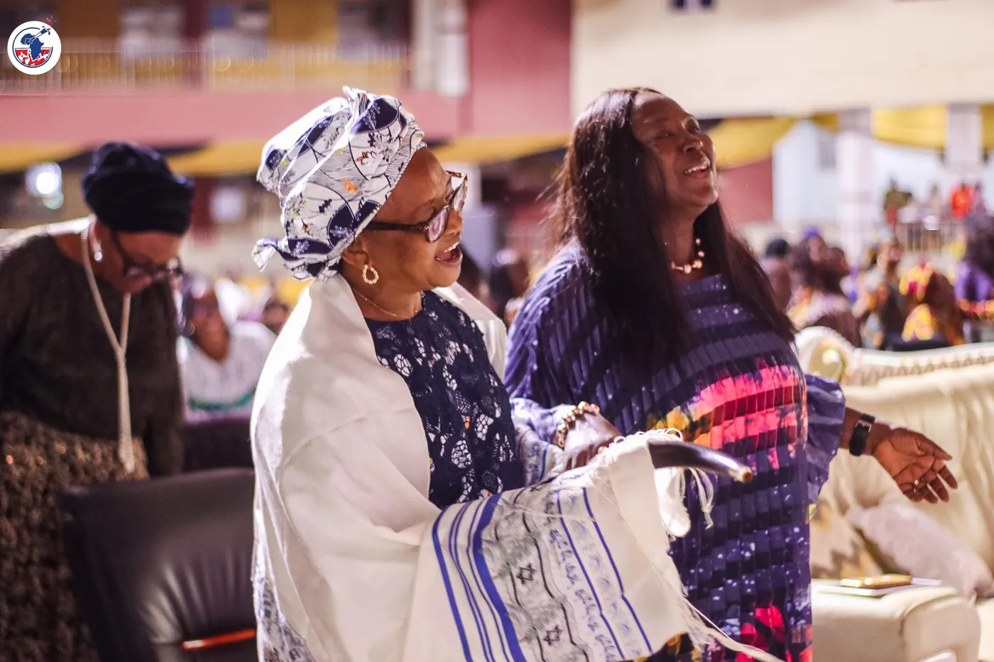 Women of the Alliance embracing at the gathering.