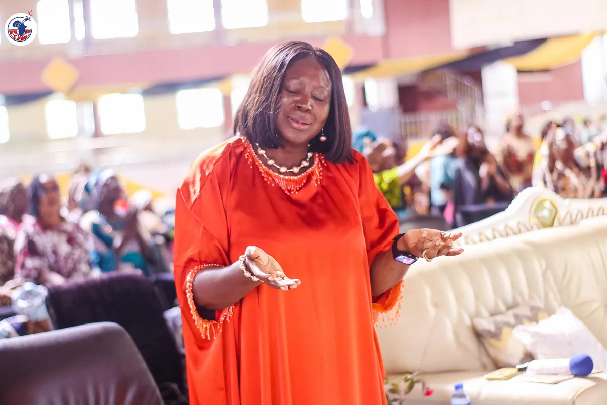 A woman ministering with expression at the WIGPA conference.